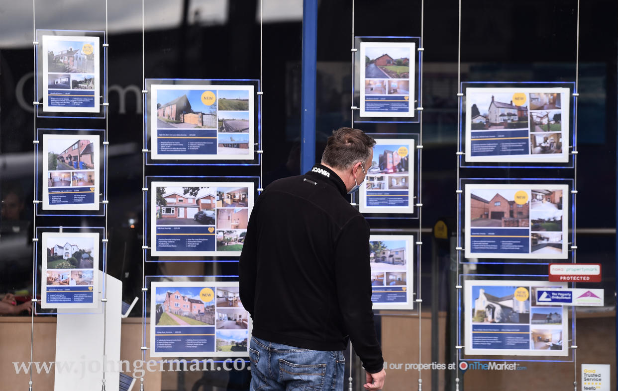 UTTOXETER-ENGLAND - MAY 05: A man is seen looking at houses for sale at an estate agents on May 05, 2021 in Uttoxeter, England . (Photo by Nathan Stirk/Getty Images) (Photo by Nathan Stirk/Getty Images)