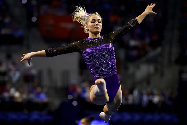 <p>James Gilbert/Getty</p> Olivia Dunne of the LSU Tigers competes during a meet against the Florida Gators at the Stephen C. O'Connell Center on February 23, 2024