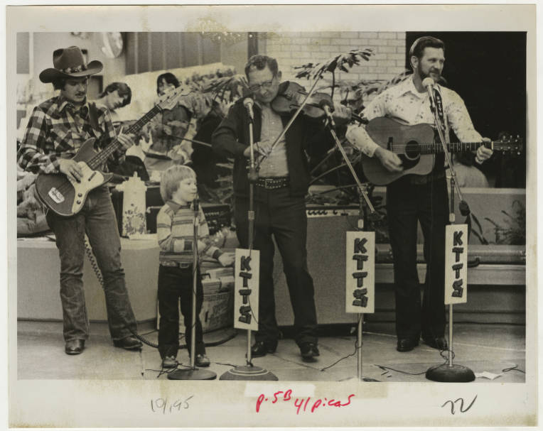 Former Springfield Newspapers photographer Hyler Cooper captured this photograph of 5-year-old Billy White playing the spoons with the Country Drifters Band, which performed on Saturday, Jan. 5, 1980 at the Northtown Mall. The performance was part of a music festival sponsored by KTTS radio to raise money for United Cerebral Palsy of Southwest Missouri. The festival was held in conjunction with a telethon hosted by Springfieldian, advertising executive and ragtime piano player Gary Ellison.