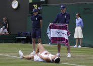 Russia's Margarita Gasparyan lays injured on the court against Ukraine's Elina Svitolina in a Women's singles match during day three of the Wimbledon Tennis Championships in London, Wednesday, July 3, 2019. (AP Photo/Kirsty Wigglesworth)