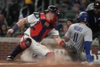 Los Angeles Dodgers' Miguel Rojas (11) beats a tag by Atlanta Braves catcher Sean Murphy, left, to score on a Mookie Betts double in the sixth inning of a baseball game, Monday, May 22, 2023, in Atlanta. (AP Photo/John Bazemore)