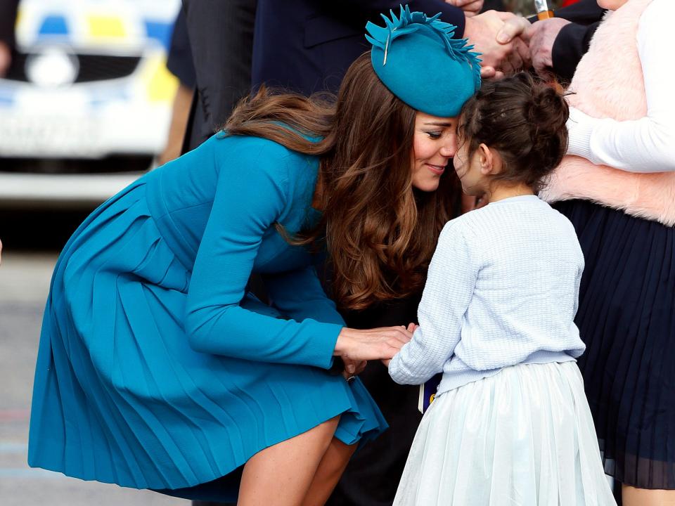 Kate Middleton receives a traditional Maori welcome from a young girl