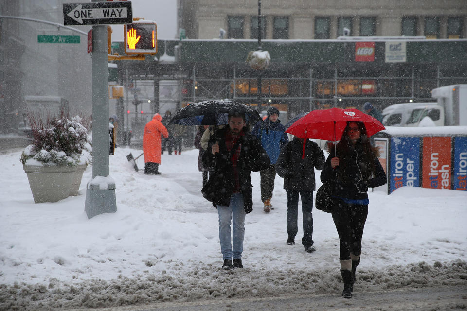 <p>People make their way through wind and snow in the Flatiron District on Feb. 9, 2017, during a winter storm in New York. A powerful, fast-moving storm swept through the northeastern U.S. Thursday, making for a slippery morning commute and leaving some residents bracing for blizzard conditions. (Photo: Gordon Donovan/Yahoo News) </p>