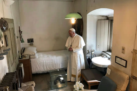 Pope Francis visits the cell of Saint Pio of Pietrelcina (Padre Pio) in San Giovanni Rotondo, Italy, March 17, 2018. Osservatore Romano/Handout via REUTERS