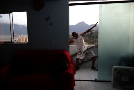 Elias da Silva Brito (nicknamed Bolt), 19, who trains in the Mangueira Olympic Village, poses inside his house in Mangueira slum in Rio de Janeiro, Brazil, August 15, 2016. REUTERS/Ricardo Moraes