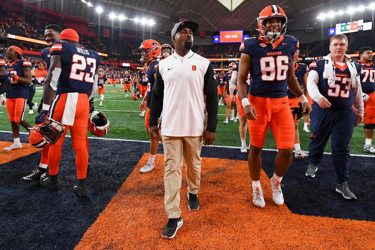 Syracuse Orange head coach Fran Brown walks on the field following a game against the Ohio Bobcats at the JMA Wireless Dome.