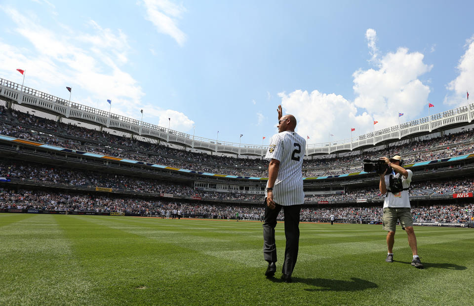 NEW YORK, NY - AUGUST 13: Former New York Yankee Derek Jeter waves as he is introduced during a ceremony honoring the '96 Yankee championship before a game against the Tampa Bay Rays inning of a game at Yankee Stadium on August 13, 2016 in the Bronx borough of New York City. (Photo by John Munson-Pool/Getty Images)