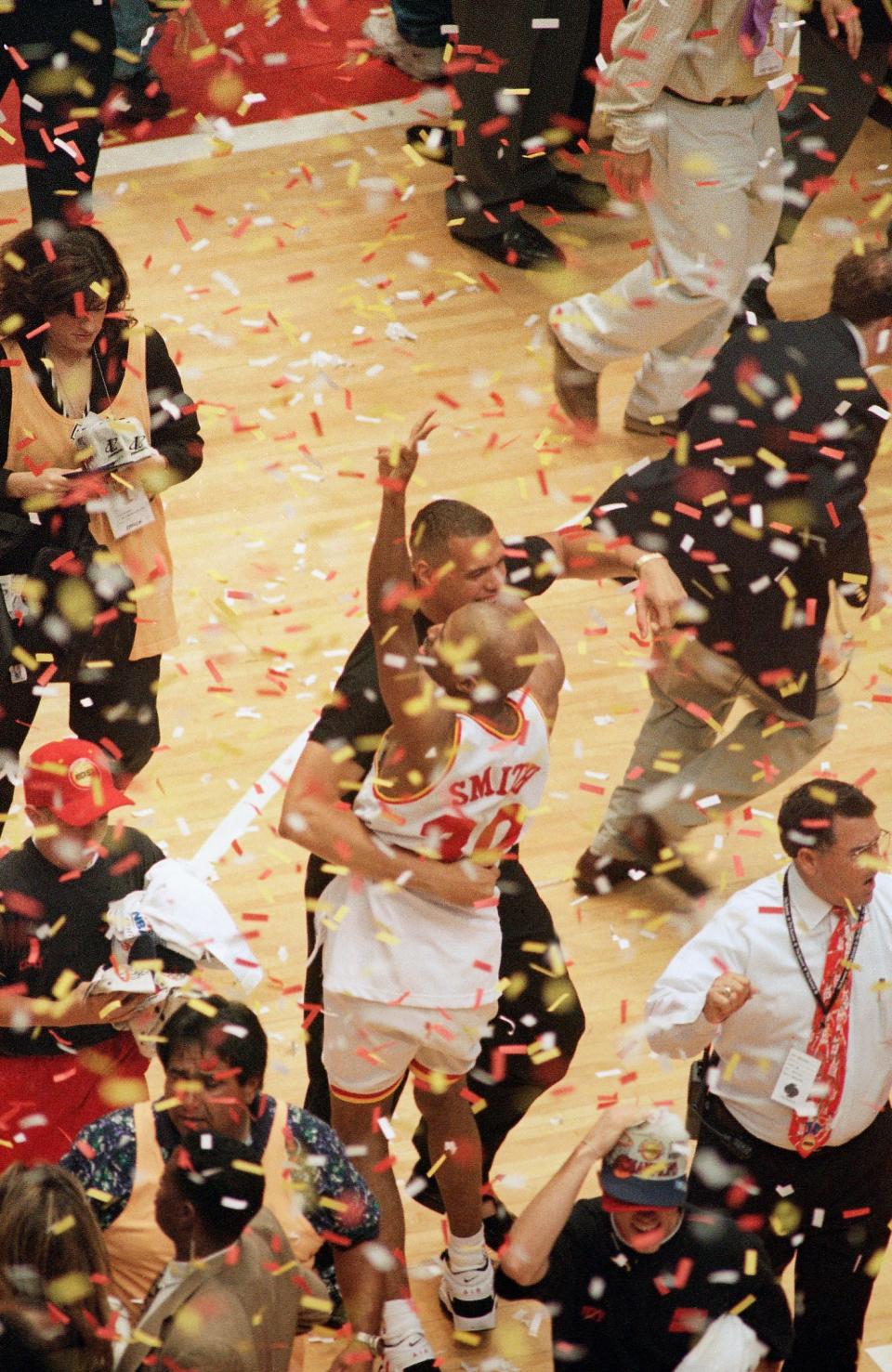 Houston Rockets' Kenny Smith (30) celebrates after the Rockets beat the Orlando Magic 113-101 in Game 4 of the NBA Finals to sweep the best-of-seven series in Houston, June 14, 1995. (AP Photo/Pat Sullivan)