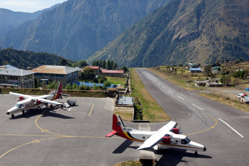 <b><p>Lukla Airport, Nepal </p></b> <p>With a lofty mountain on one end and a steep angled drop thousands of feet deep on the other, any error on the pilot’s end can cause grave complications during landing or take-off.</p>
