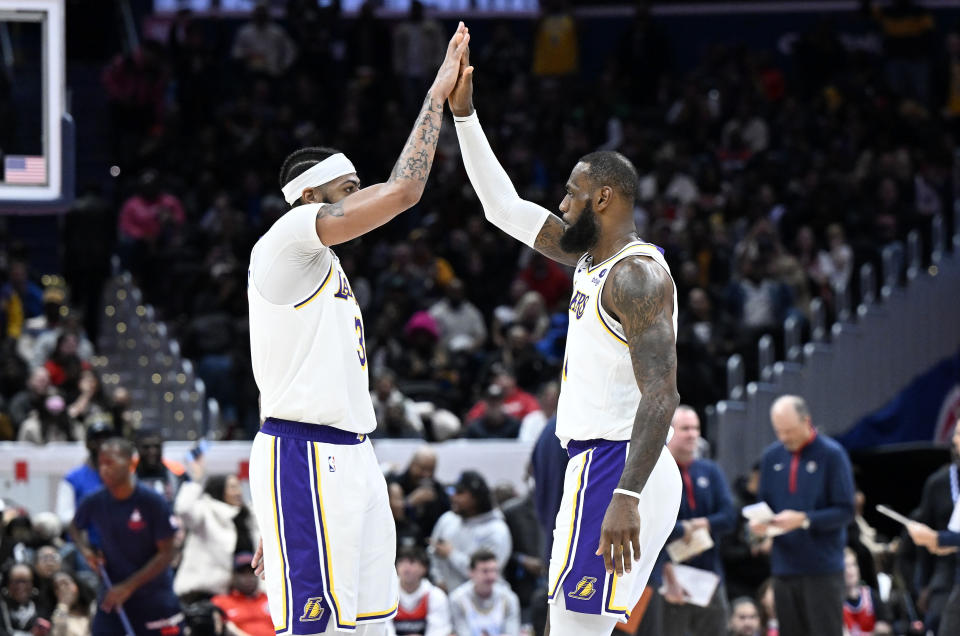 WASHINGTON, DC - DECEMBER 04: Anthony Davis #3 and LeBron James #6 of the Los Angeles Lakers celebrate during the fourth quarter of the game against the Washington Wizards at Capital One Arena on December 04, 2022 in Washington, DC. NOTE TO USER: User expressly acknowledges and agrees that, by downloading and or using this photograph, User is consenting to the terms and conditions of the Getty Images License Agreement.  (Photo by Greg Fiume/Getty Images)