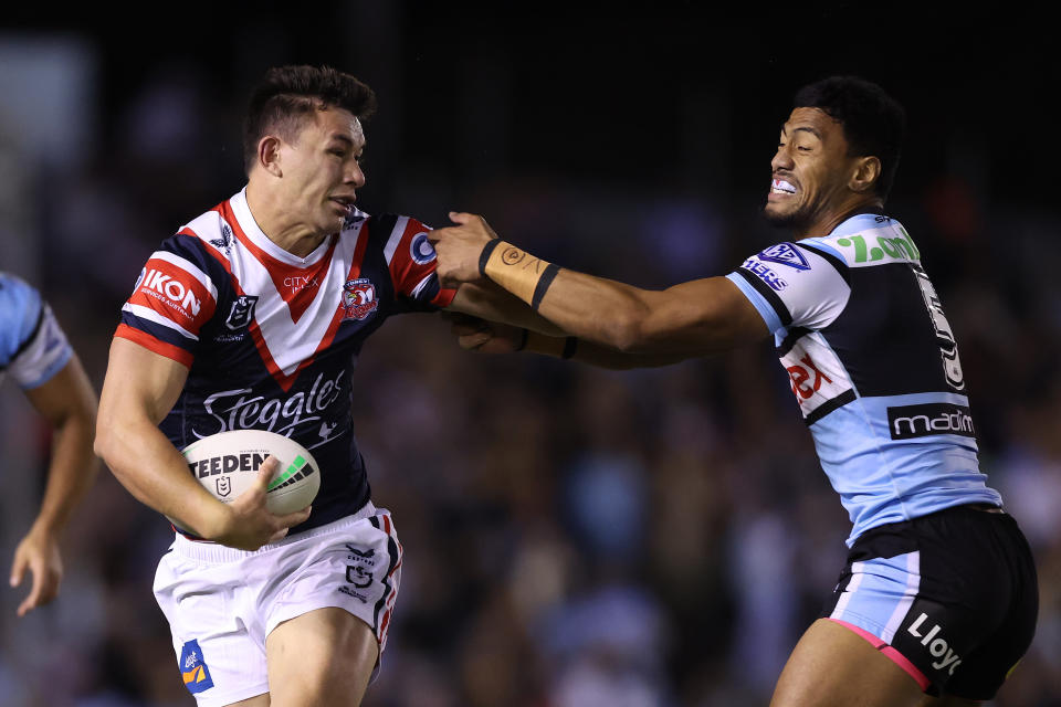 SYDNEY, AUSTRALIA - SEPTEMBER 09:  Joseph Manu of the Roosters is tackled by Ronaldo Mulitalo of the Sharks during the NRL Elimination Final match between Cronulla Sharks and Sydney Roosters at PointsBet Stadium on September 09, 2023 in Sydney, Australia. (Photo by Mark Metcalfe/Getty Images)