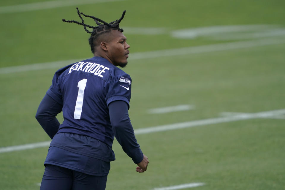 Seattle Seahawks wide receiver D'Wayne Eskridge tracks a pass as he runs a drill during NFL football practice Tuesday, June 15, 2021, in Renton, Wash. (AP Photo/Ted S. Warren)