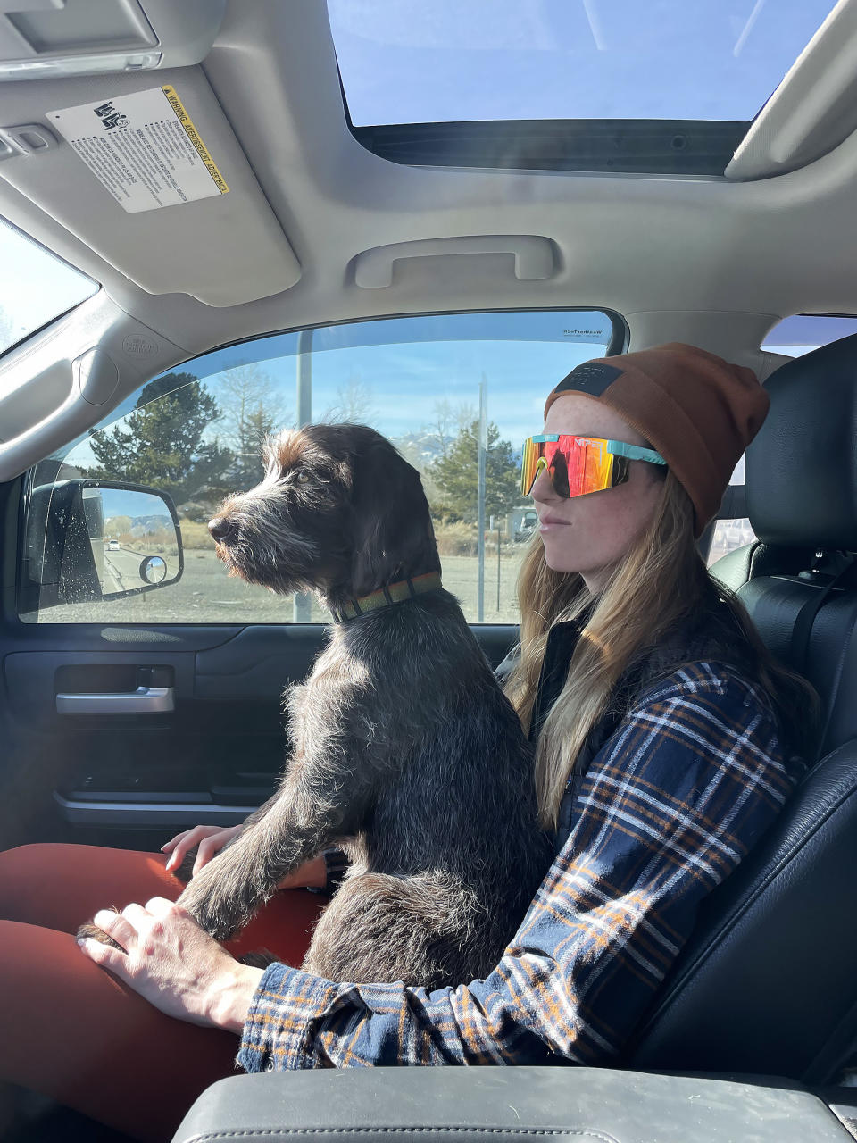 dog on camping trip with woman