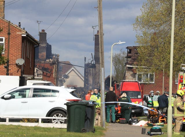 Paramedics and emergency services attend to an injured person at the scene