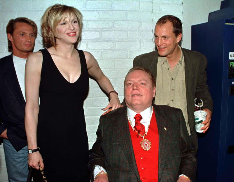 Magazine publisher Larry Flynt (in wheelchair) poses with the cast of the new film based on his life..