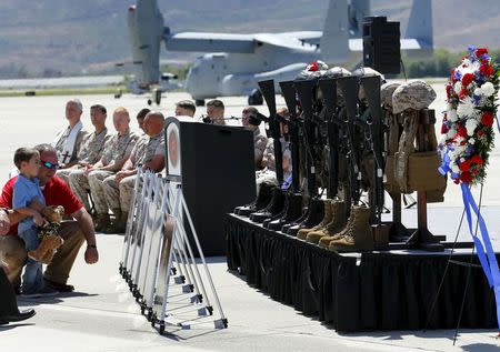 Nathan Johnson attends a memorial in honor of his father Sergeant Johnson IV and five others who lost their lives during the crash of their Marine helicopter while it was coming to the aid of earthquake victims in Nepal, at Camp Pendleton in California June 3, 2015. REUTERS/Mike Blake