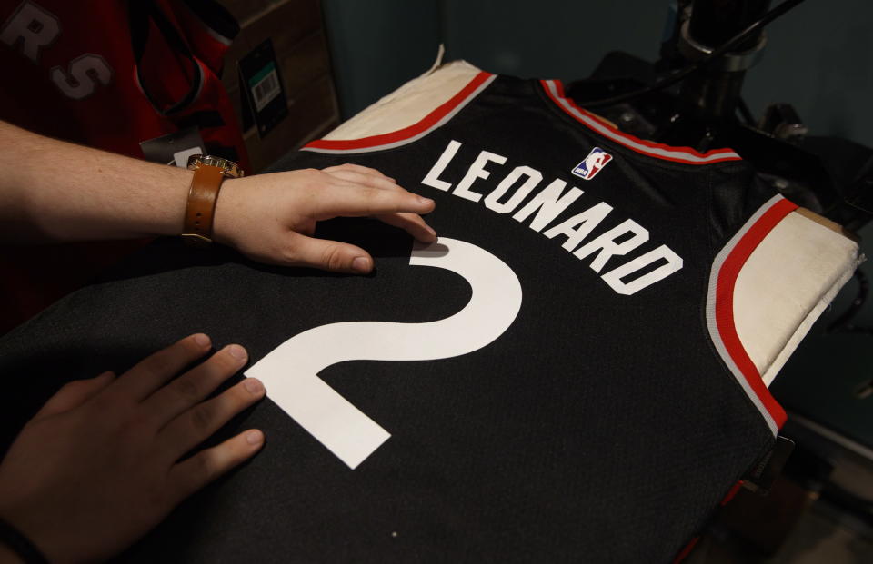 Kawhi Leonard will be wearing a new jersey and, presumably, new shoes in the upcoming NBA season. (AP)