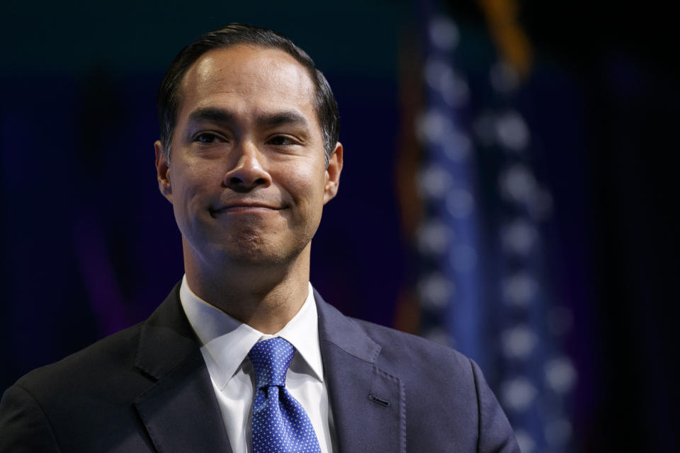 Former Housing and Urban Development Secretary and Democratic presidential candidate Julian Castro listens to a question at the J Street National Conference, with the hosts of "Pod Save the World," Monday, Oct. 28, 2019, in Washington. (AP Photo/Jacquelyn Martin)