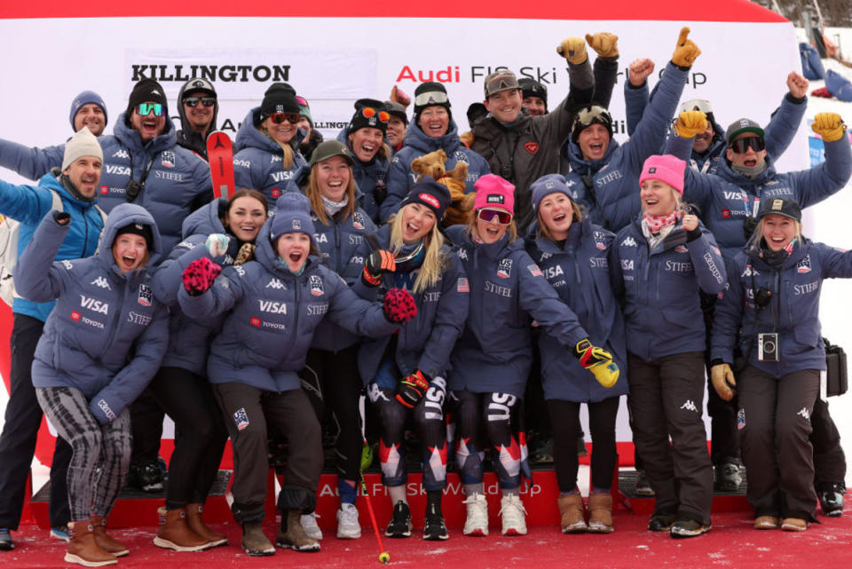Mikaela Shiffrin of Team USA (center) take a group photo with the Women's US Ski Team and staff after she finished first place in the Women's Slalom at the Stifel Killington FIS World Cup race on November 26, 2023 in Killington, Vermont.<p>Photo by Sean M. Haffey/Getty Images</p>