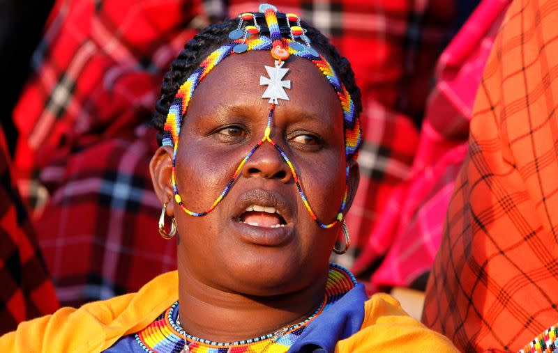 A Maasai woman dressed in traditional regalia attends a memorial service for late former Kenya's President Daniel Arap Moi at the Nyayo Stadium in Nairobi