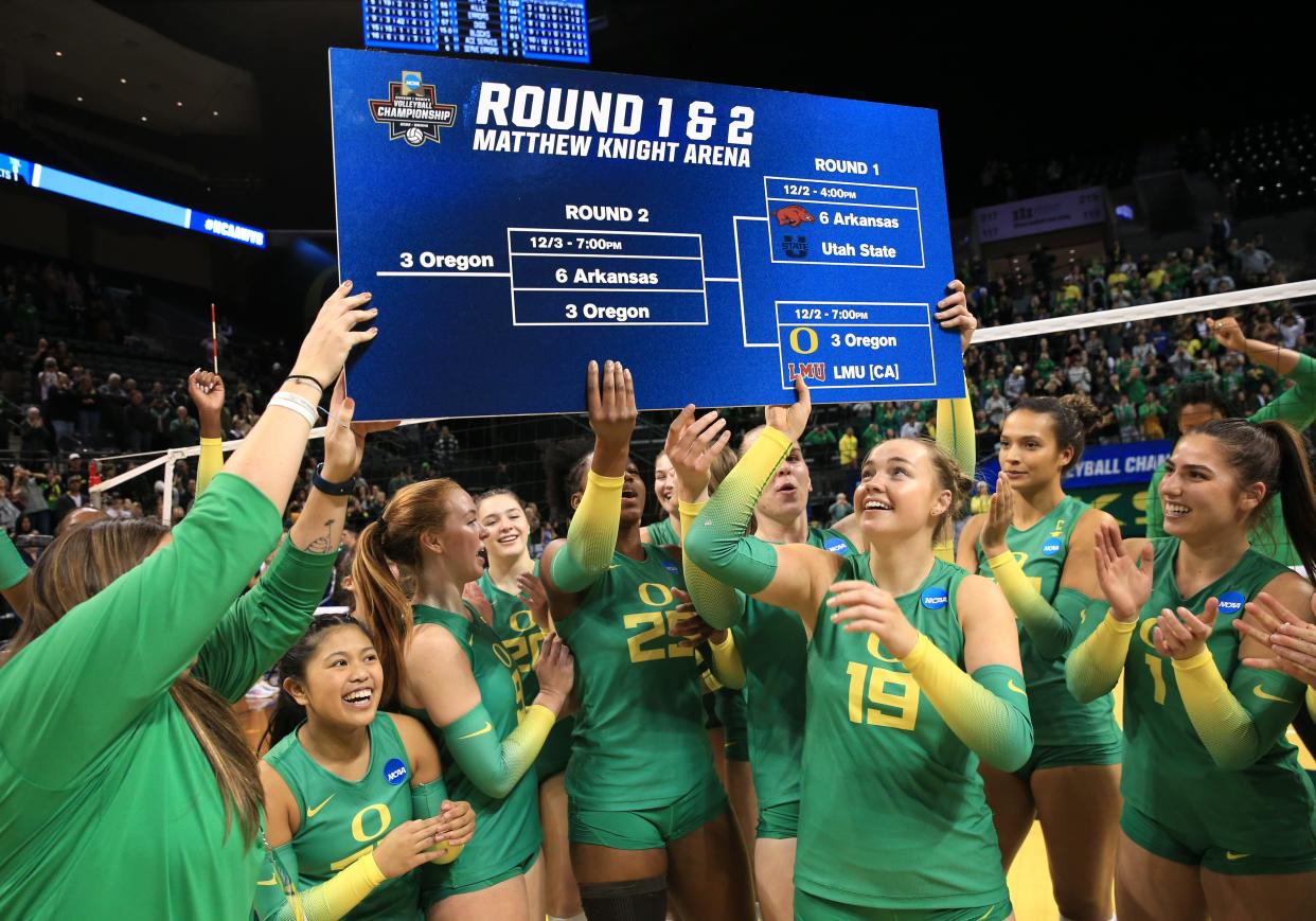 The UO Volleyball team celebrates their NCAA Round 2 victory over Arkansas in Eugene.