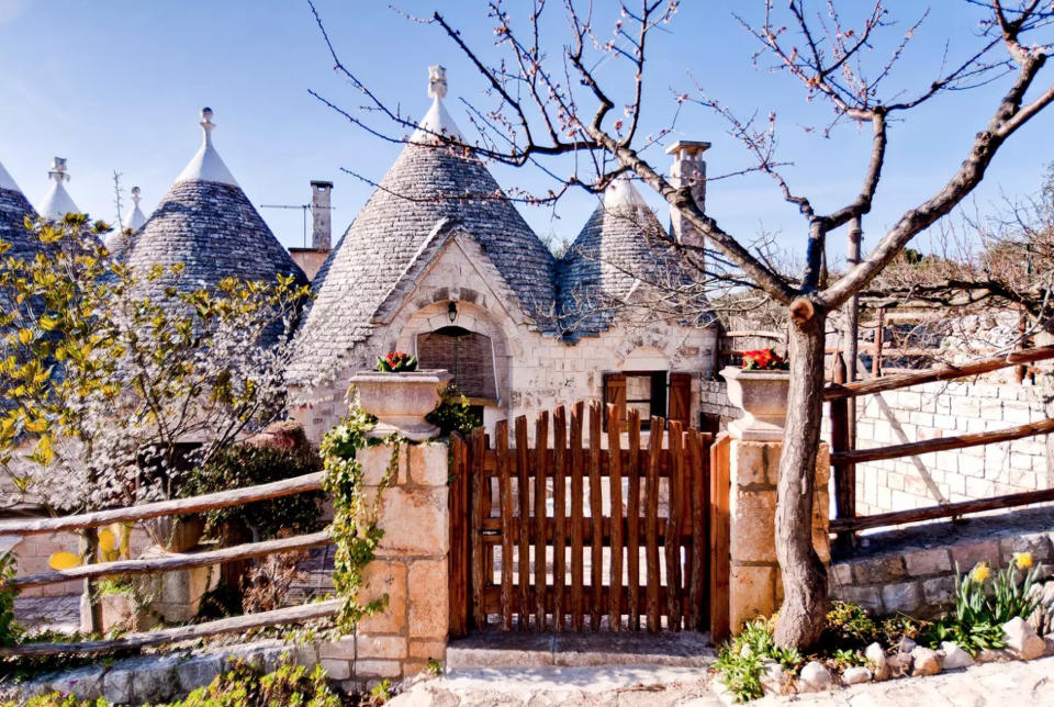 <p>Globe trotters will have to book flights to Italy for a chance to stay in the world’s most popular Airbnb. For £64 per night, guests can reside at Sette Coni – which translates to the seven cones – in Ostuni. The stone cottage is located near to must-see tourist hotspots such as the caves of Castellana, the cities of Lecce and Martina Franca and the excavations of Egnazia.<br>According to the listing, it’s a perfect location for nature lovers with a traditional patio area sitting pretty beneath an olive tree – we challenge you to find a greater location to read your new book. Don’t believe us? A grand total of 164,444 Airbnb users have wish listed the property so far. <strong><a rel="nofollow noopener" href="https://www.airbnb.co.uk/rooms/432044" target="_blank" data-ylk="slk:Book now;elm:context_link;itc:0;sec:content-canvas" class="link ">Book now</a></strong>. <em>[Photo: Caters]</em> </p>