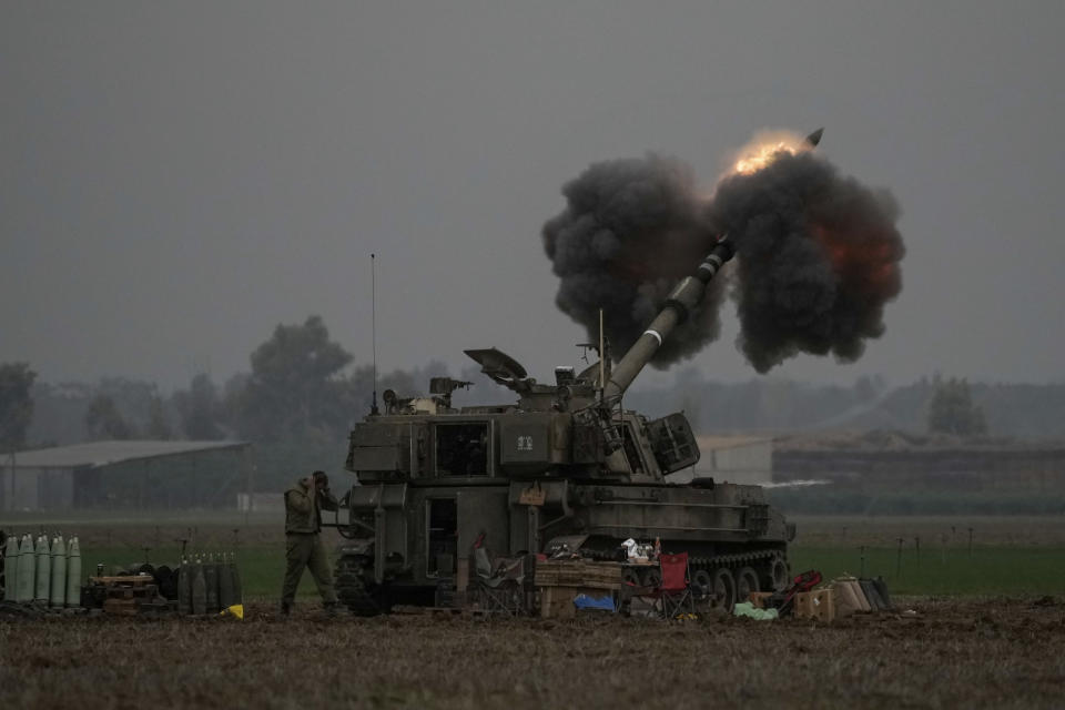 An Israeli mobile artillery unit fires a shell from southern Israel towards the Gaza Strip, in a position near the Israel-Gaza border on Thursday, Dec. 14, 2023. (AP Photo/Leo Correa)