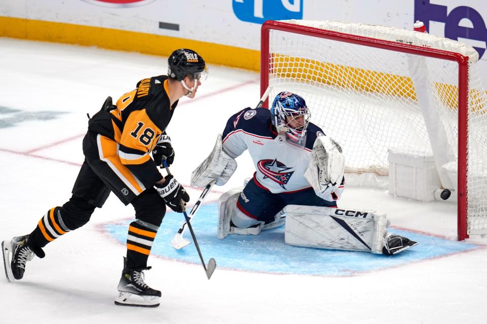 Pittsburgh Penguins' Jesse Puljujarvi (18) gets a shot past Columbus Blue Jackets goalie Jet Greaves for a goal during the first period of an NHL hockey game in Pittsburgh, Tuesday, March 5, 2024. (AP Photo/Gene J. Puskar)