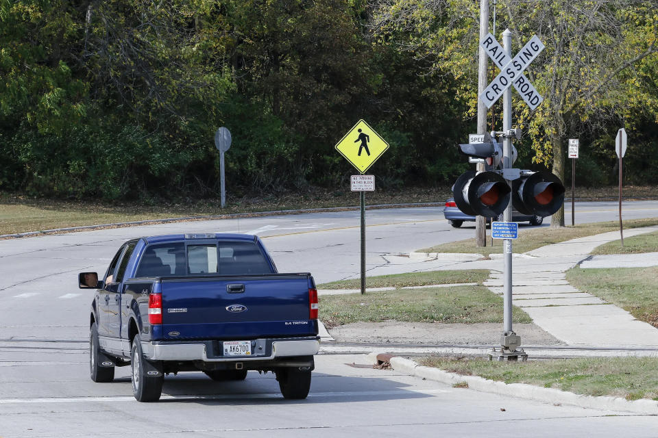 FILE - The Meadow Lane railroad crossing near Henry Schuette Park in Manitowoc.