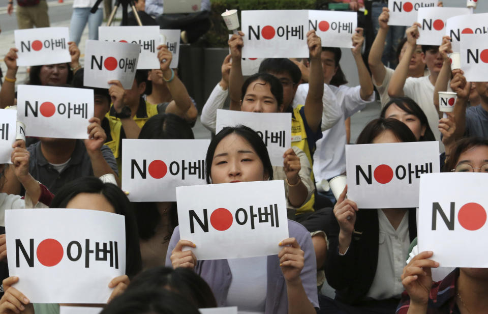 Protesters stage a rally denouncing the Japanese government's decision on their exports to South Korea in front of the Japanese embassy in Seoul, South Korea, Thursday, July 18, 2019. The signs read: " No Abe (Japanese Prime Minister Shinzo Abe)." (AP Photo/Ahn Young-joon)