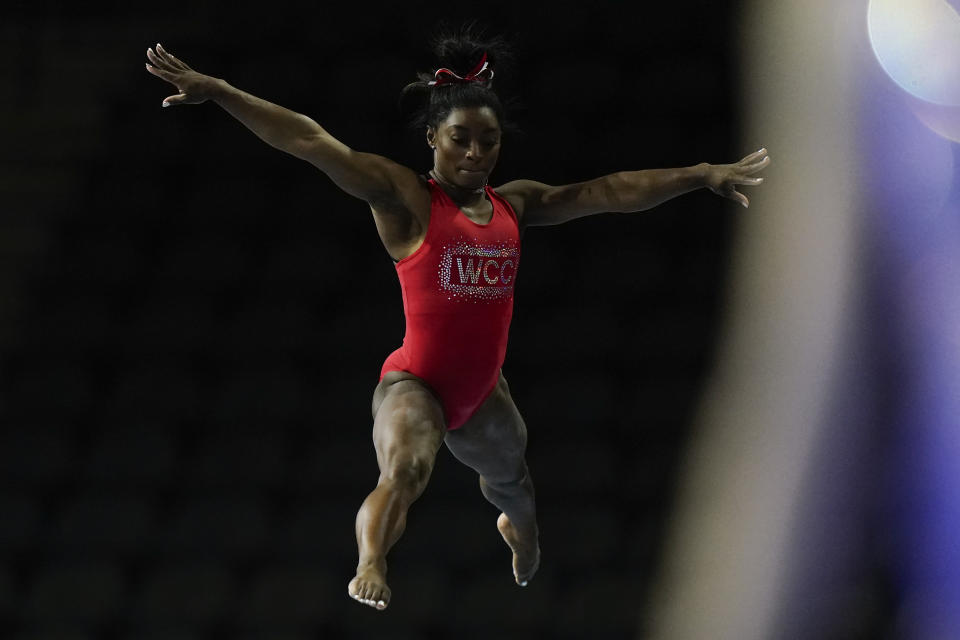 Simone Biles, a seven-time Olympic medalist and the 2016 Olympic champion, practices on the balance beam at the U.S. Classic gymnastics competition Friday, Aug. 4, 2023, in Hoffman Estates, Ill. (AP Photo/Morry Gash)