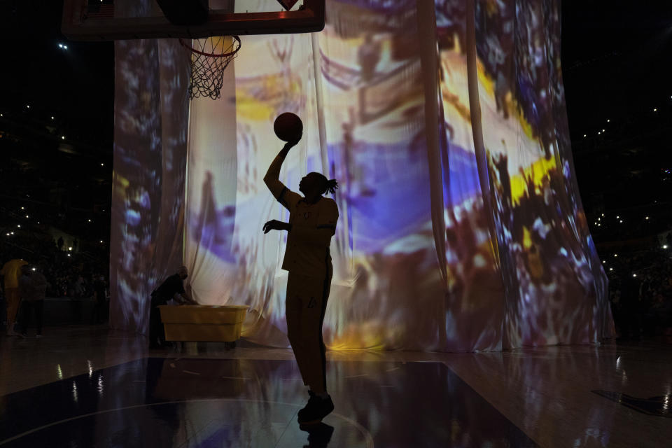 Los Angeles Lakers' Dwight Howard shoots during a pregame presentation before the team's NBA basketball game against the San Antonio Spurs Thursday, Dec. 23, 2021, in Los Angeles. (AP Photo/Jae C. Hong)