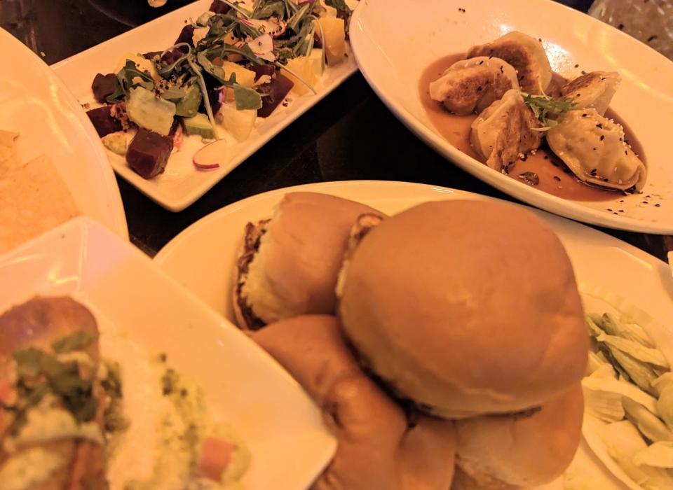 plate of food at the cheesecake factory: sliders, potstickers