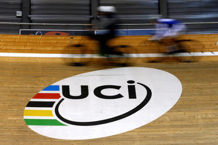 A trainee of the World Cycling Center warms up around the velodrome after a media event on motor detection in Aigle, Switzerland May 3, 2016. REUTERS/Denis Balibouse