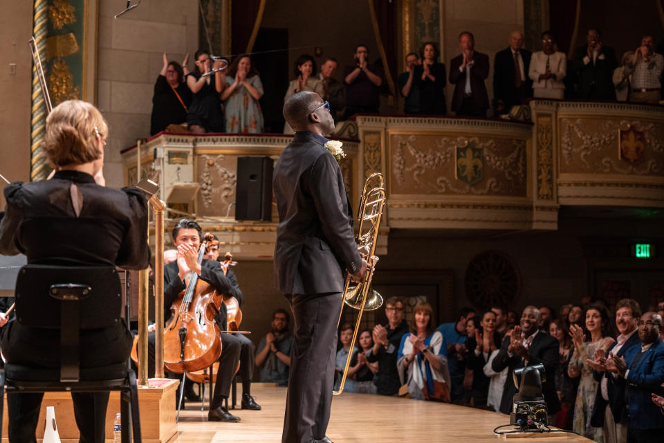 Detroit Symphony Orchestra trombonist Kenneth Thompkins receives a standing ovation at Orchestra Hall following the premiere of Carlos Simon's "Troubled Water" trombone concerto on May 6, 2023.