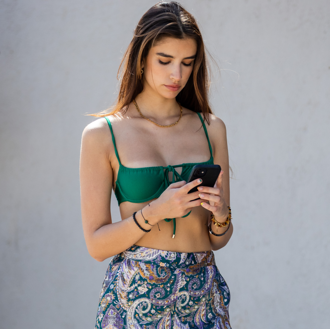  Alexandra Nicole is seen wearing green bikini top Janthee Berlin and pants with floral print Chinti on April 07, 2021 in Tulum, Mexico. 