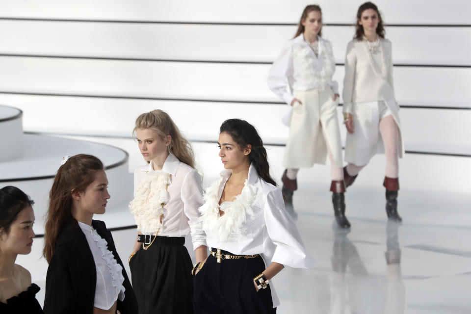 Models wear creations for the Chanel fashion collection during Women's fashion week Fall/Winter 2020/21 presented in Paris, Tuesday, March 3, 2020. (AP Photo/Thibault Camus)