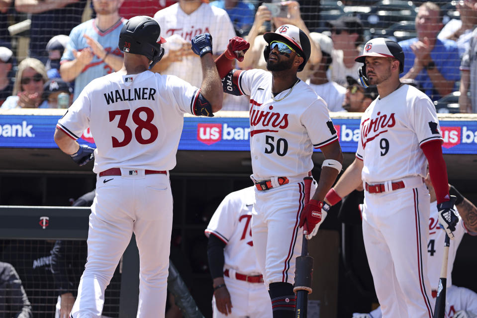 Minnesota Twins' Matt Wallner (38) celebrates with teammates after hitting a home run during the fourth inning of a baseball game against the Seattle Mariners, Wednesday, July 26, 2023, in Minneapolis. (AP Photo/Stacy Bengs)