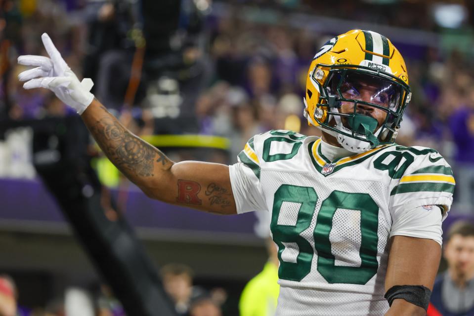 Green Bay Packers' Bo Melton celebrates his touchdown catch during the second half of an NFL football game against the Minnesota Vikings Sunday, Dec. 31, 2023, in Minneapolis. (AP Photo/Bruce Kluckhohn)