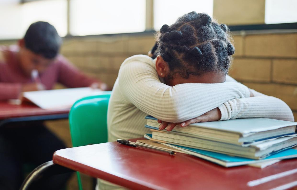 Symptoms of post-traumatic stress disorder can vary from one student to the next. <a href="https://www.gettyimages.com/detail/photo/want-to-go-home-royalty-free-image/1160693779?phrase=classroom%20test%20&adppopup=true" rel="nofollow noopener" target="_blank" data-ylk="slk:LumiNola via Getty Images;elm:context_link;itc:0;sec:content-canvas" class="link ">LumiNola via Getty Images</a>