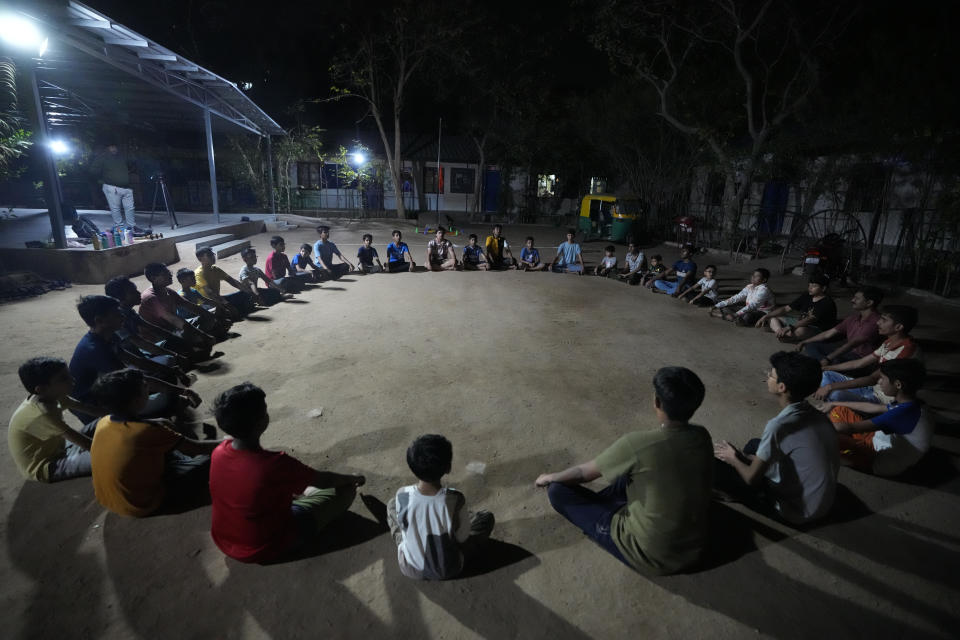 Youth and children participate in Hindu nationalist organisation Rashtriya Swayamsevak Sangh (RSS)'s shakha in Ahmedabad, India, April 8, 2024. Shakhas, or local units, induct boys by combining religious education with self-defense skills and games. (AP Photo/Ajit Solanki)