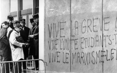 Graffiti at Nanterre University, near Paris, in 1968 reads "Long live the strike, Long live student-worker unity, Long live Marxism" - Credit: AFP/Getty Images