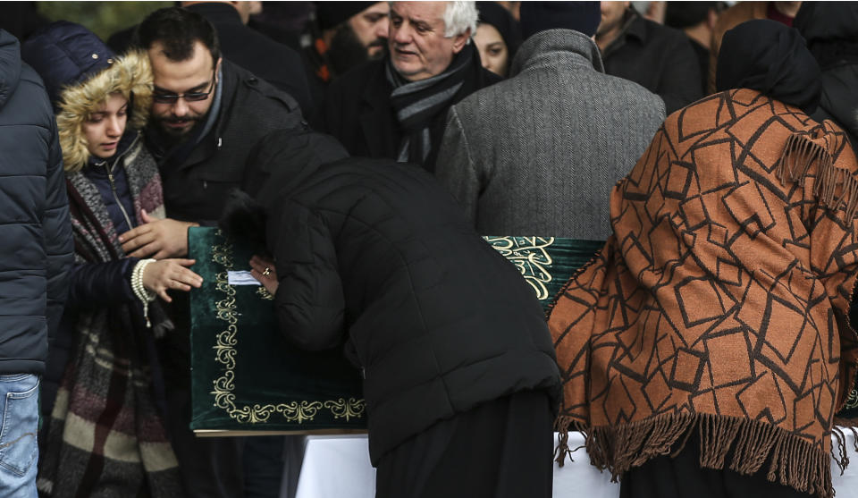 Mourning family members attend the funeral prayers for nine members of Alemdar family killed in a collapsed apartment building, in Istanbul, Saturday, Feb. 9, 2019. Turkey's President Recep Tayyip Erdogan says there are "many lessons to learn" from the collapse of a residential building in Istanbul where at least 17 people have died.(AP Photo/Emrah Gurel)