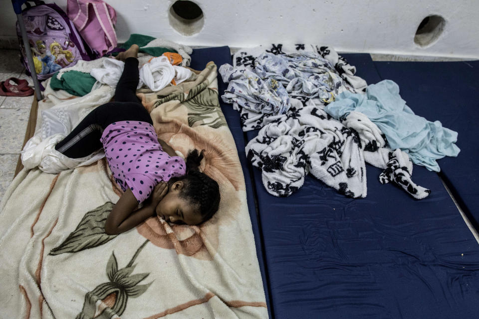 Israeli child rests inside a bomb shelter at the costal city of Ashkelon, Israel, Wednesday, Nov. 13, 2019.Israeli aircraft have struck Islamic Jihad targets throughout the Gaza Strip while the militant group rained scores of rockets into Israel for a second straight day as the heaviest round of fighting in months showed no signs of ending. (AP Photo/Tsafrir Abayov)