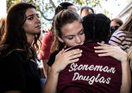 <p>Students from Marjory Stoneman Douglas High School attend a memorial following a school shooting incident in Parkland, Fla., Feb. 15, 2018. (Photo: Thom Baur/Reuters) </p>