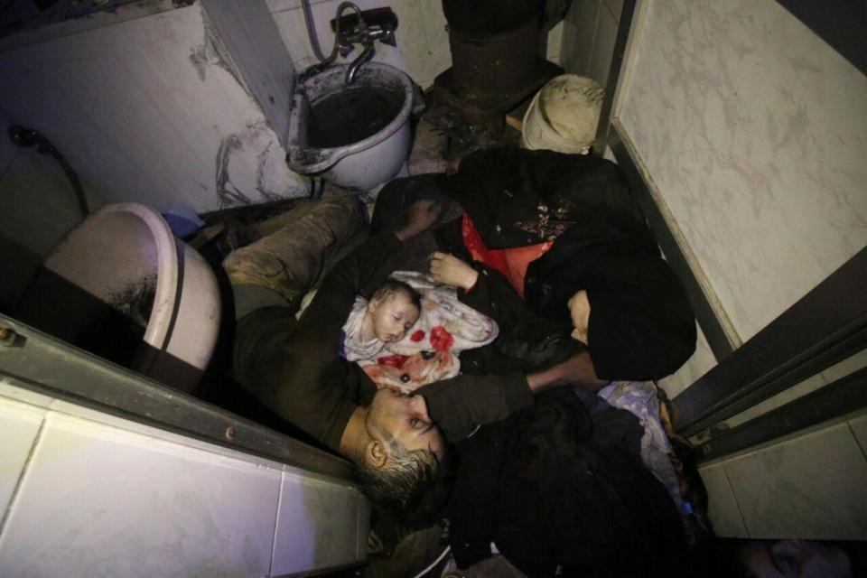 <p>Dead bodies of a Syrian family are seen after Assad regime forces allegedly conducted poisonous gas attack to Douma town of Eastern Ghouta in Damascus, Syria on April 7, 2018. (Photo: Stringer/Anadolu Agency/Getty Images) </p>