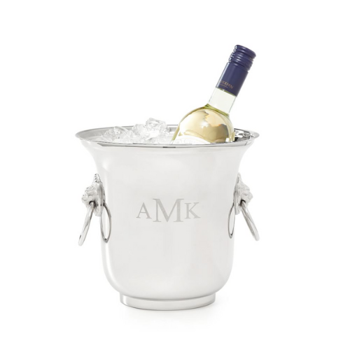 champagne bucket filled with ice and champagne bottle against white background