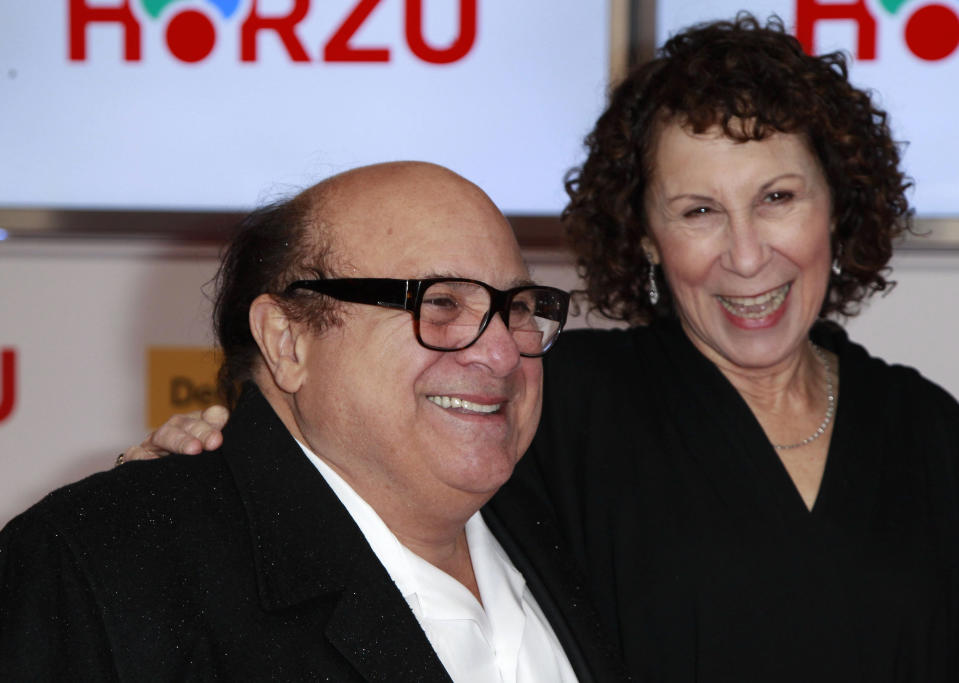 U.S.actor Danny Devito (L) and his wife U.S. actress Rhea Perlman arrive on the red carpet for the 46th 'Goldene Kamera' (Golden Camera) awards ceremony at the Ullstein Auditorium in Berlin, February 5, 2011. The Golden Cameras are awarded by a popular German TV-magazine honouring excellence in the areas of television, film and entertainment. REUTERS/Thomas Peter (GERMANY - Tags: ENTERTAINMENT) 