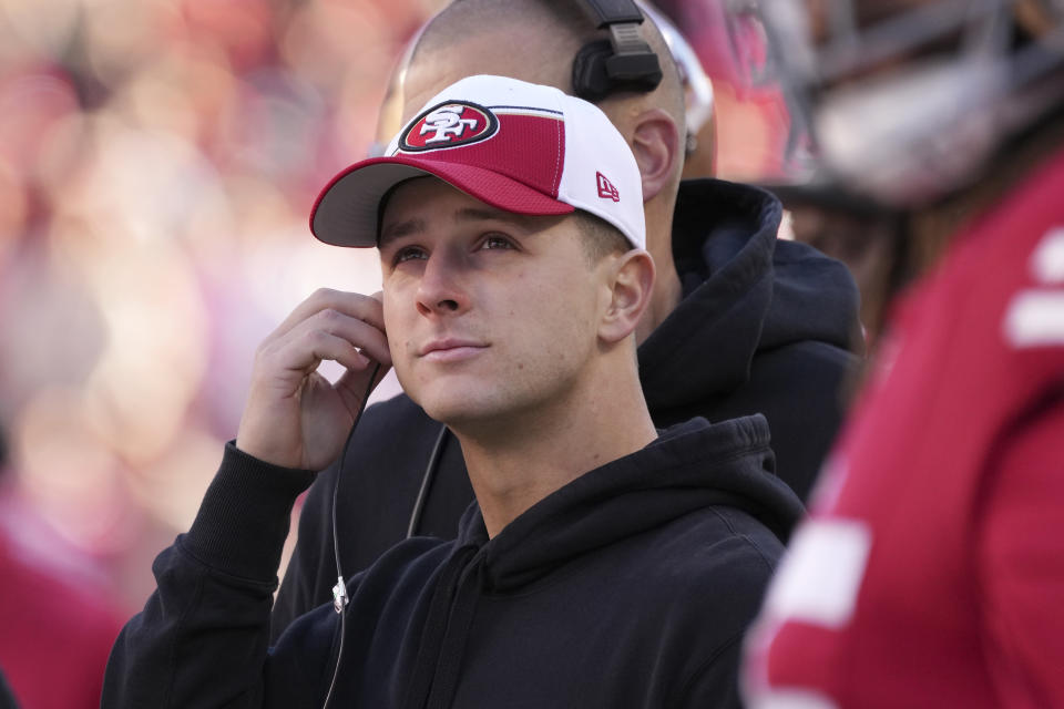 San Francisco 49ers quarterback Brock Purdy watches from the sideline during the first half of an NFL football game against the Los Angeles Rams in Santa Clara, Calif., Sunday, Jan. 7, 2024. (AP Photo/Loren Elliott)