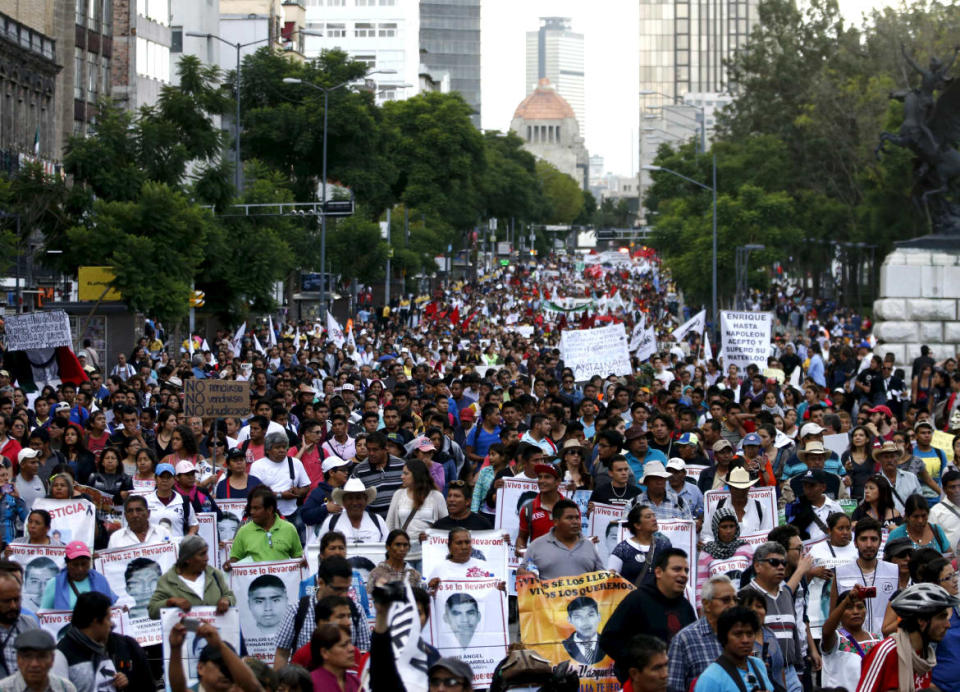 <div class="inline-image__caption"><p>Relatives gathered in Mexico City with pictures of their missing family.</p></div> <div class="inline-image__credit">REUTERS/Henry Romero</div>